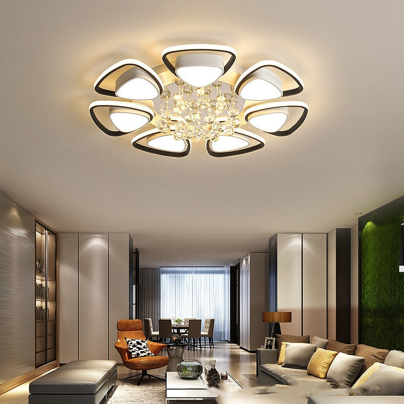 High-end modern ceiling light illuminating a cozy bedroom with elegant decor

