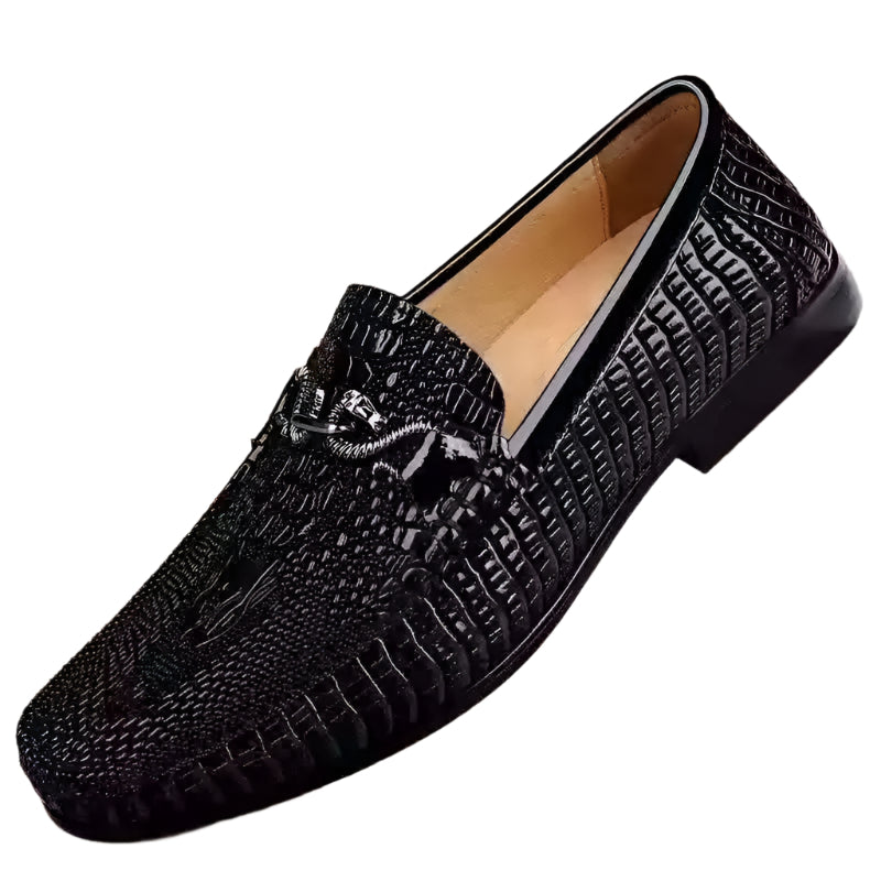 Men’s slip-on driving shoes in snake-pattern embossed leather with flat sole design.

