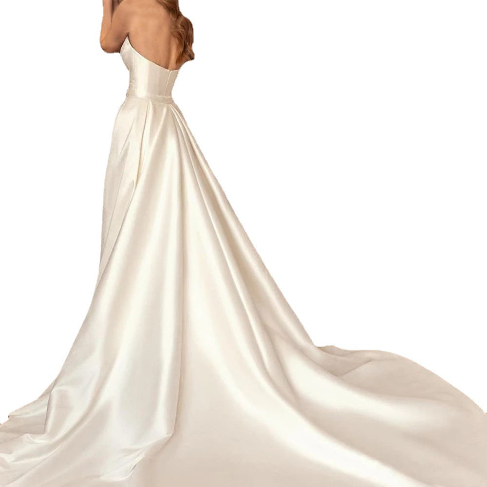 Elegant satin sheath wedding dress with a backless design, high waist fit, and a two-way detachable train for a customizable bridal look.

