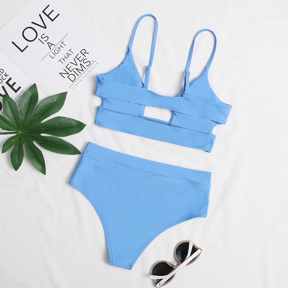 Surf Siren high-waist bikini featuring a retro-inspired design with a flattering high-waisted bottom for added comfort and support. Made from stretchy, durable fabric, perfect for beach days, poolside lounging, and stylish summer fun.