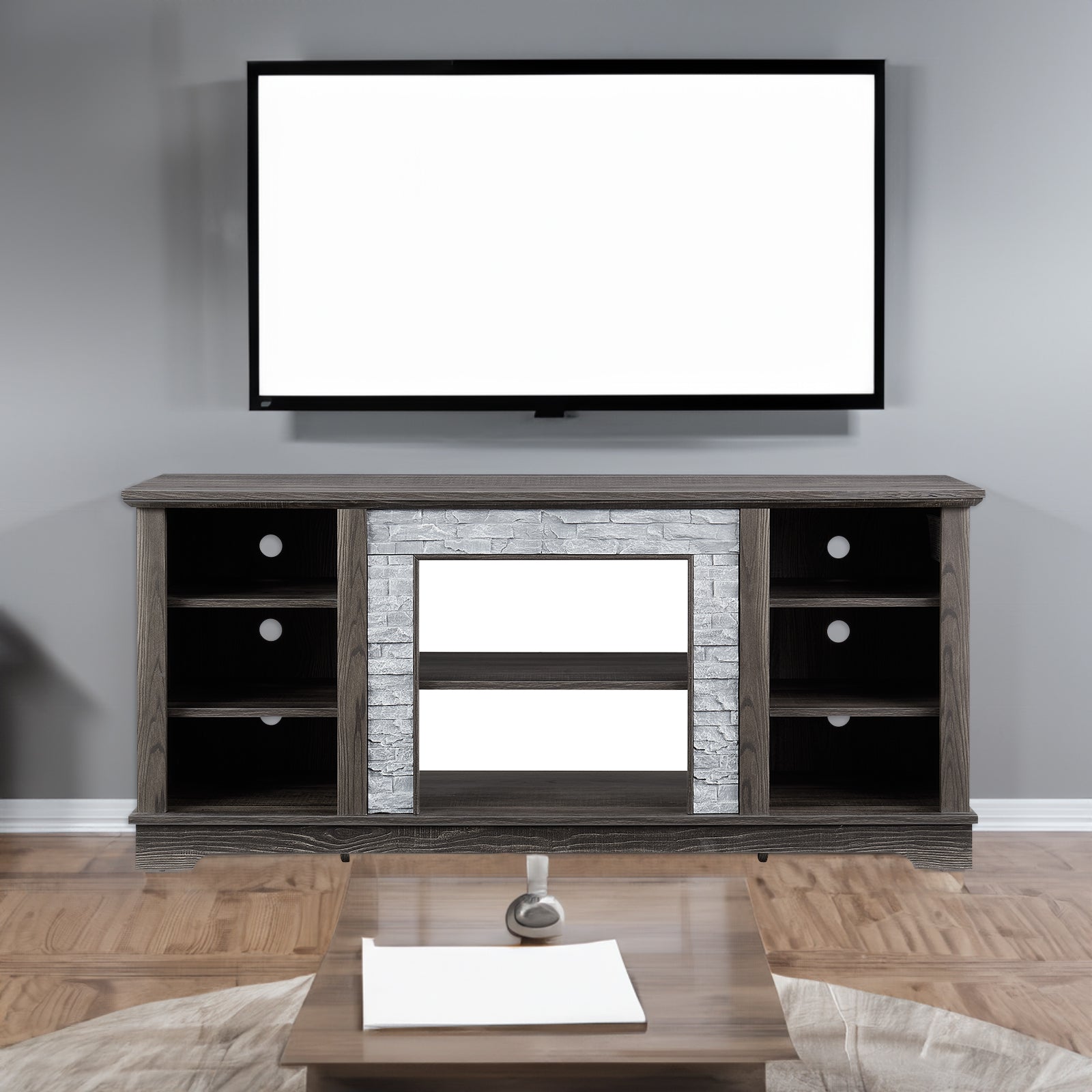 Modern gray stone TV console with open shelves and stacked stone frame