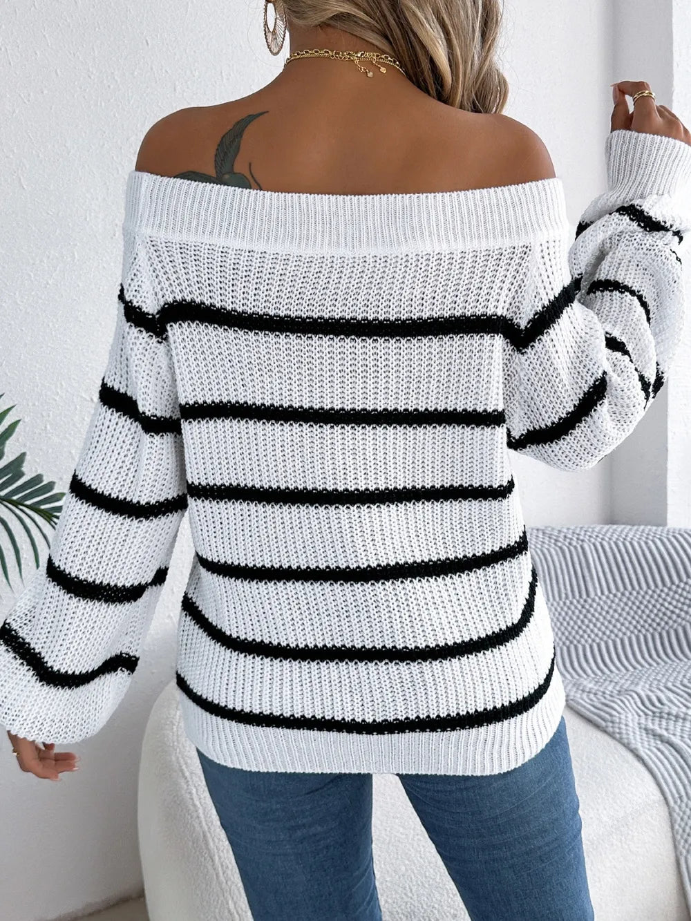 Women's striped off-shoulder sweater with long sleeves, front view

