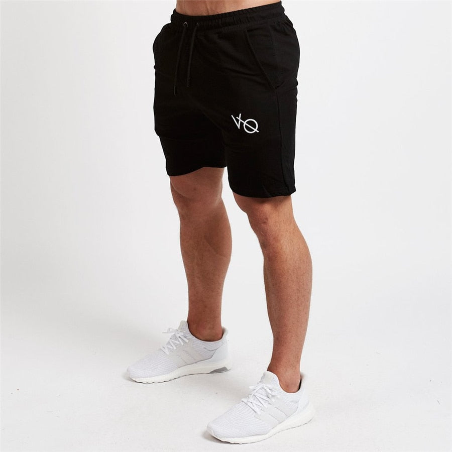 "Men's workout running shorts made from lightweight, moisture-wicking fabric for comfort and breath ability. The shorts feature an elastic waistband with an adjustable drawstring, side pockets, and a relaxed fit, perfect for running or intense workout sessions."