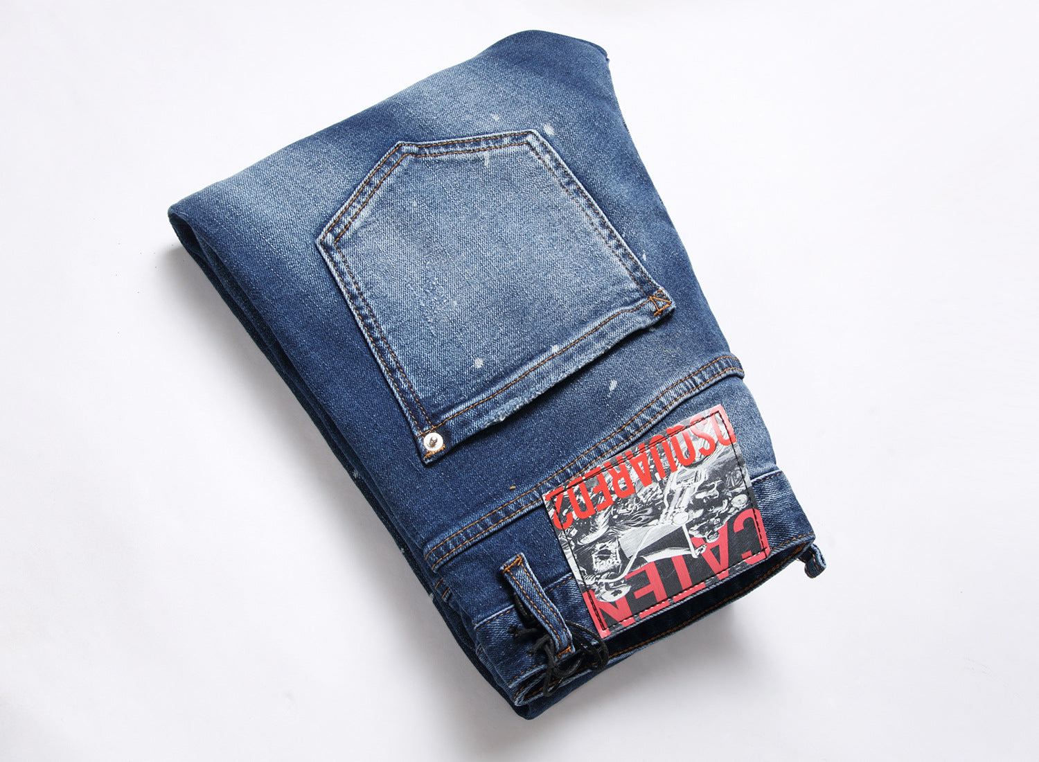 Men’s ripped fashion jeans with ornamental details, slim fit, and distressed design for a trendy streetwear look.