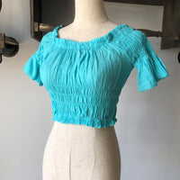Women's off-shoulder swimsuit top, beach bikini with slubbed fabric, breathable and stylish vacation swimwear.








