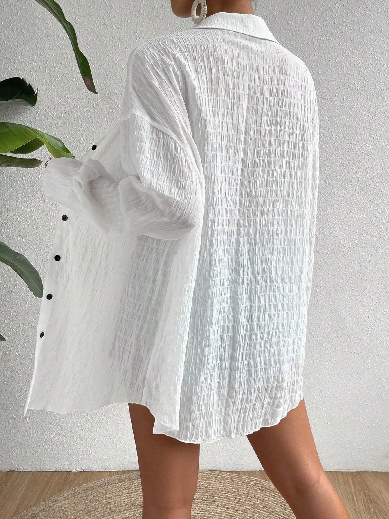 Women’s drop shoulder button front kimono long sleeve top with relaxed fit and button detailing.

