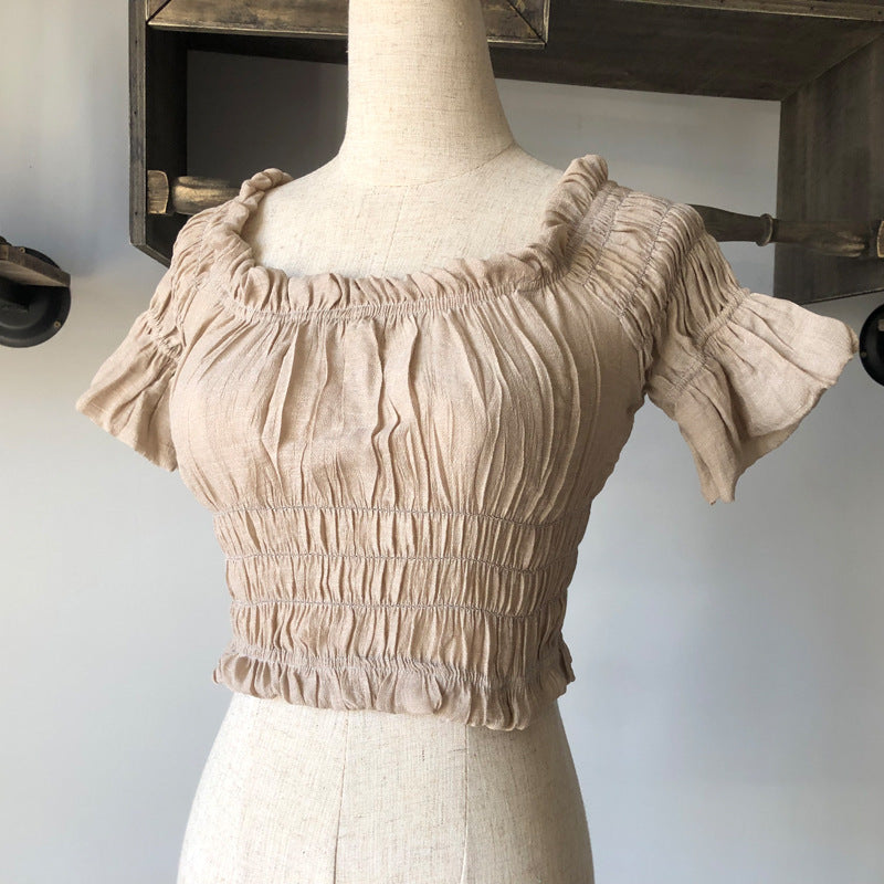 Women's off-shoulder swimsuit top, beach bikini with slubbed fabric, breathable and stylish vacation swimwear.








