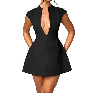 Woman wearing a black sleeveless A-line mini dress with deep V-neck and pockets.

