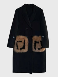 Woman wearing a solid minimalist woolen coat with a cozy scarf and boots