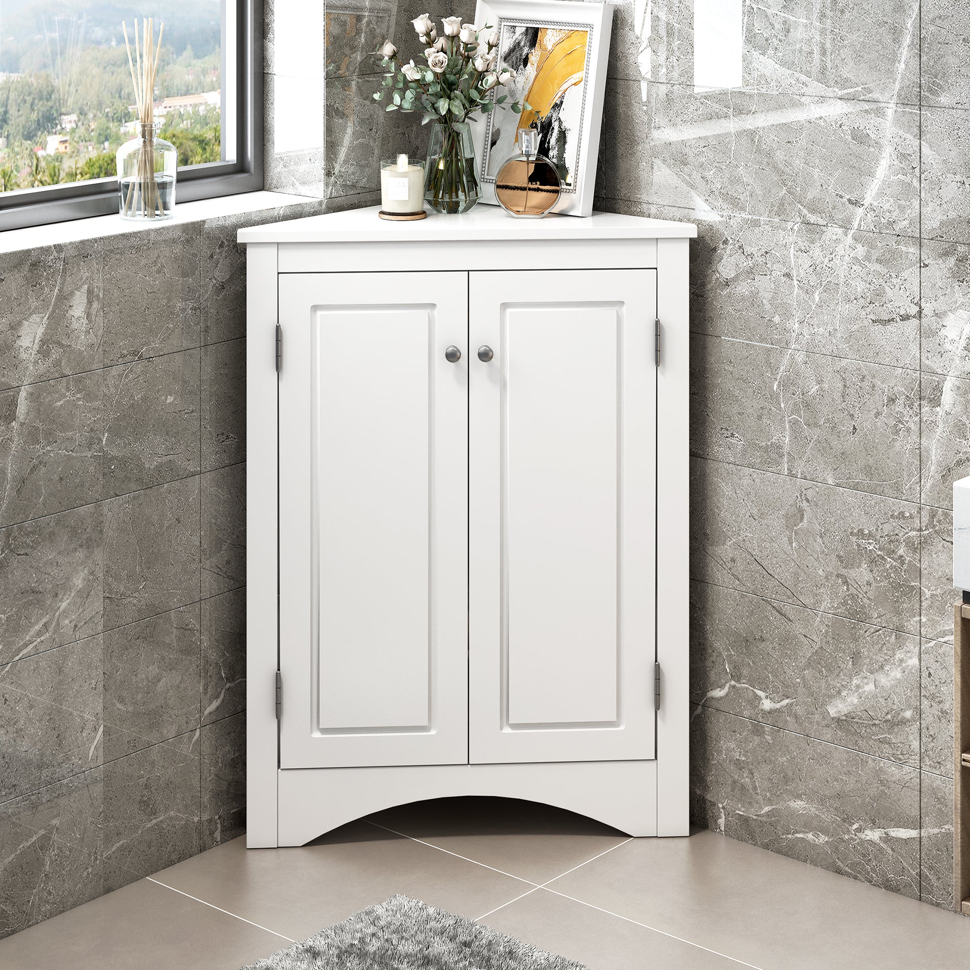 White triangle bathroom storage cabinet with a compact, space-saving design, featuring multiple shelves for organizing toiletries, towels, and other bathroom essentials. Made from durable materials, this sleek cabinet adds a functional and stylish touch to any bathroom decor.