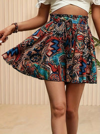 Women's summer shorts with elastic waistband and vibrant prints, ideal for casual wear and warm weather.








