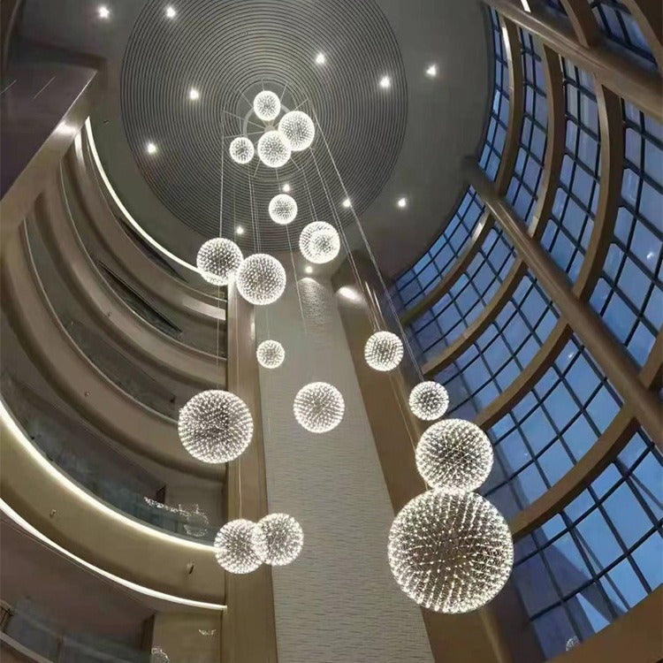 Elegant spherical ball chandelier in a modern commercial lobby

