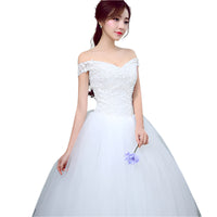 Simple and slim white wedding dress with a sleek design, perfect for brides who prefer minimalist elegance.

