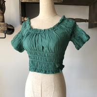 Women's off-shoulder swimsuit top, beach bikini with slubbed fabric, breathable and stylish vacation swimwear.








