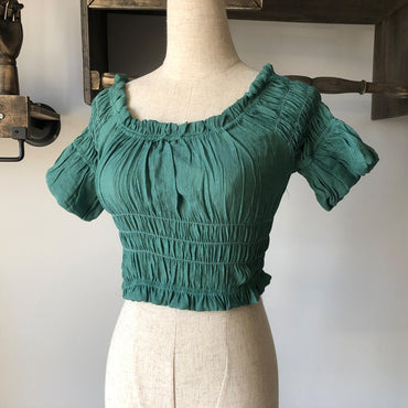 Women's off-shoulder swimsuit top, beach bikini with slubbed fabric, breathable and stylish vacation swimwear.








