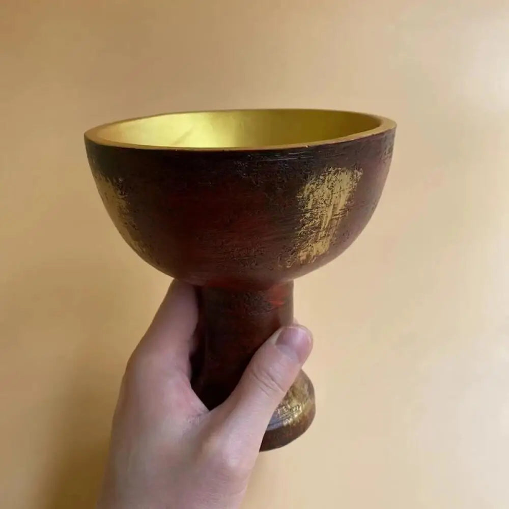 Indiana Jones Holy Grail Cup replica in vintage gold – resin prop for cosplay, Halloween, and movie-themed decor.








