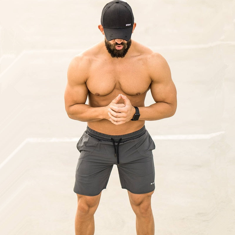 Men’s summer running shorts made from lightweight, breathable fabric, featuring an elastic waistband and moisture-wicking technology for comfort during workouts