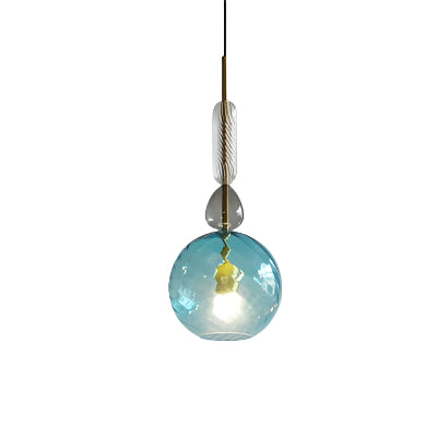 Colorful macaron-style glass chandeliers hanging over a modern bar counter

