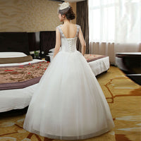 Elegant double shoulder wedding dress with luxurious fabric and intricate details, designed for a timeless and romantic bridal look.

