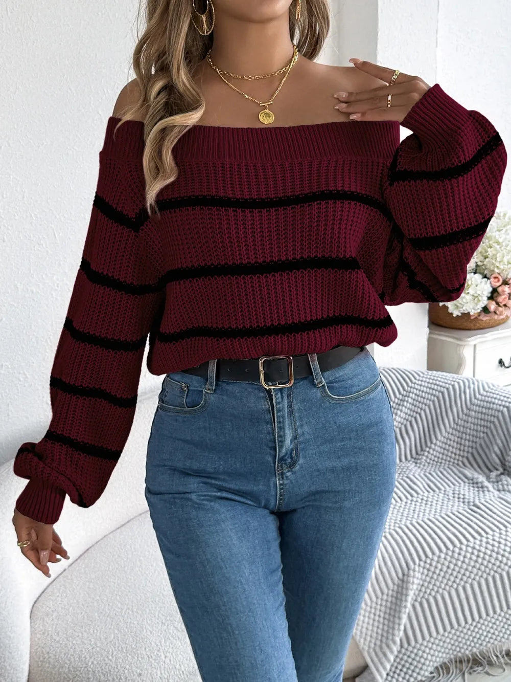 Women's striped off-shoulder sweater with long sleeves, front view

