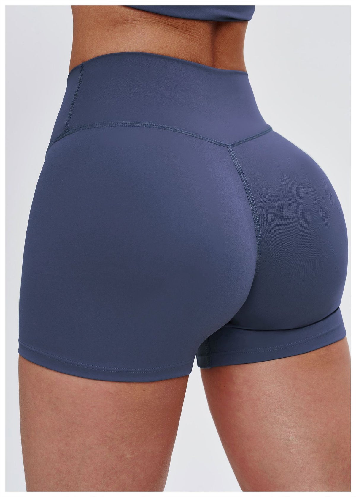 Navy blue athletic shorts on a plain background