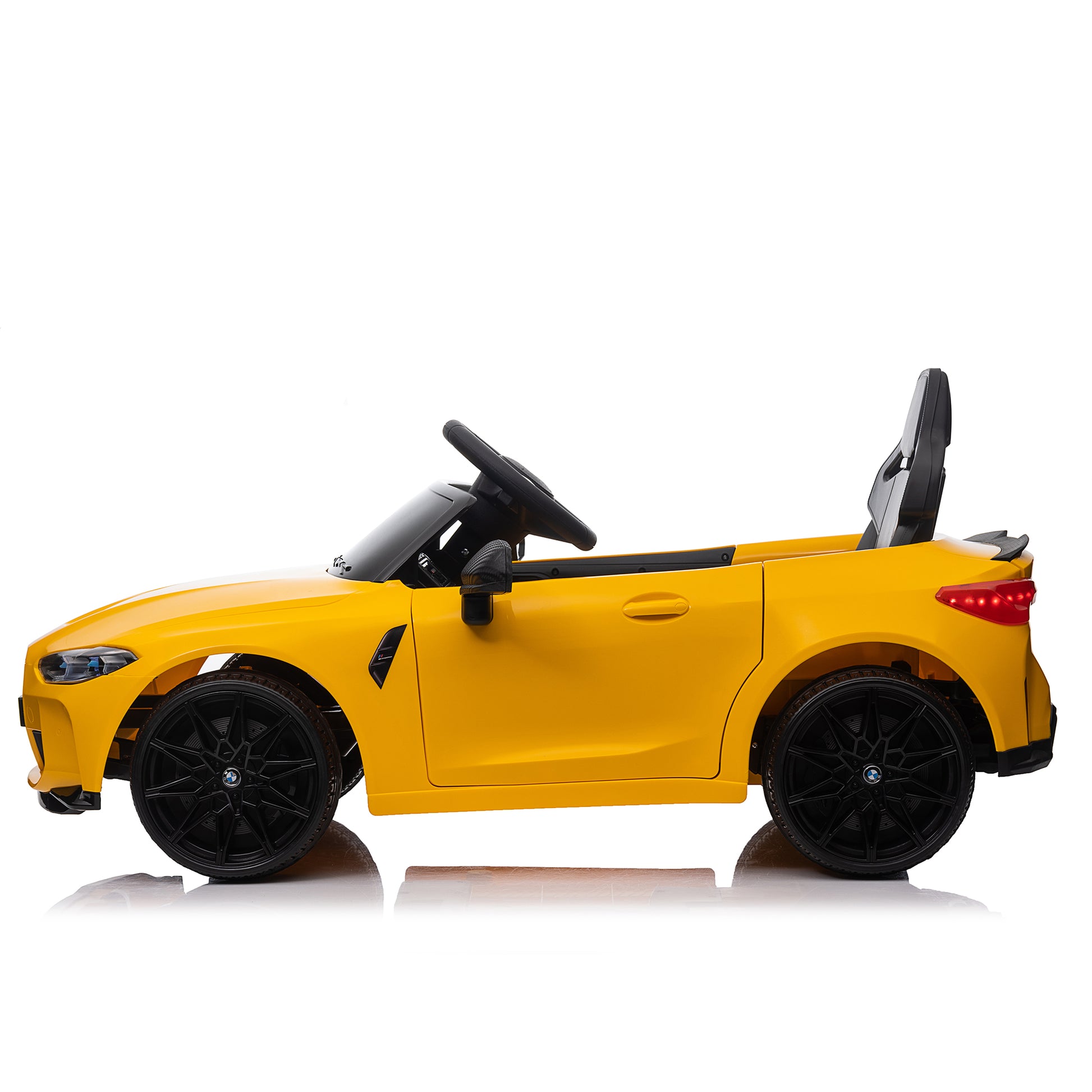 Yellow BMW M4 12V electric ride-on car for kids, featuring authentic design with working headlights, MP3 player, and forward/reverse motion. Comes with adjustable seat and steering wheel, providing a realistic driving experience for children aged 3-6