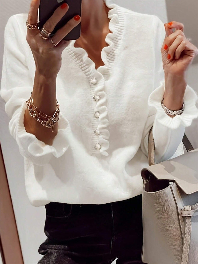 Women’s winter V-neck ruffled knitted sweater – fashion pullover with long sleeves.








