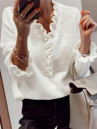 Women’s winter V-neck ruffled knitted sweater – fashion pullover with long sleeves.








