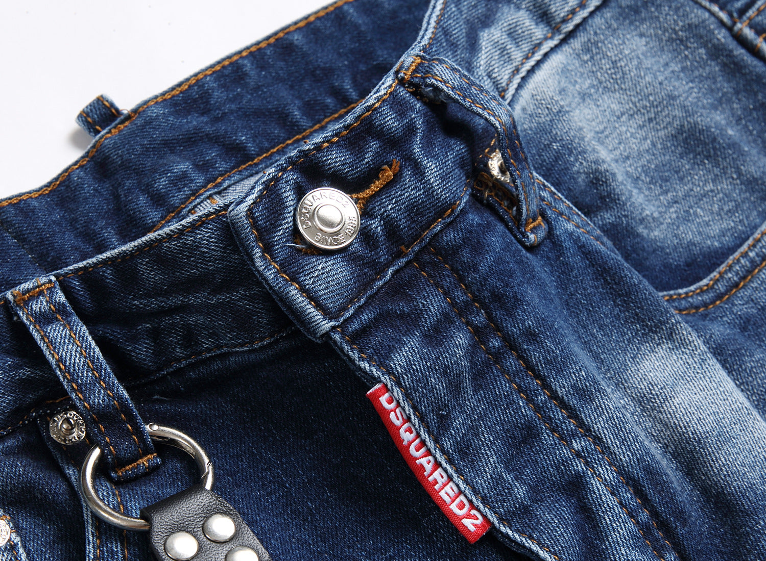 Men’s ripped fashion jeans with ornamental details, slim fit, and distressed design for a trendy streetwear look.