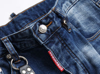 Men’s ripped fashion jeans with ornamental details, slim fit, and distressed design for a trendy streetwear look.