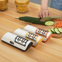 Compact multifunctional electric knife sharpener for kitchen use – automatic professional tool.


