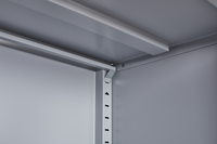 Grey metal kitchen storage cabinet with door and adjustable shelf in a modern kitchen