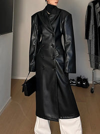 Model wearing a high-waist PU leather coat with patchwork detail and lapel collar