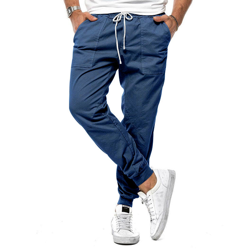 Loose tapered fit casual pants for men, perfect for spring and autumn, with multiple pockets and a stylish, comfortable design for outdoor or leisure wear.