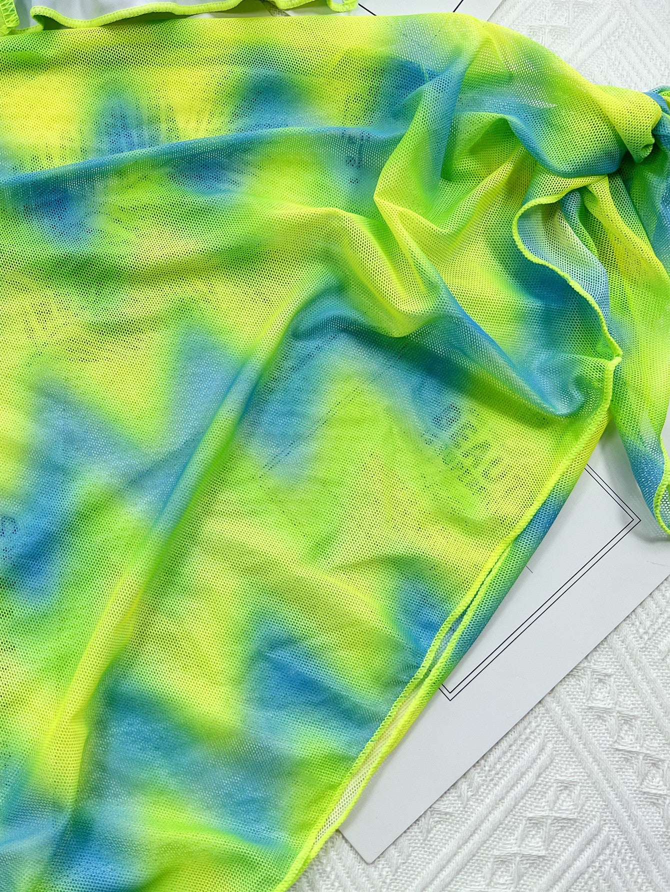 Island Crush bikini featuring a vibrant, tropical print with a flattering two-piece design. Includes adjustable straps for a custom fit and made from soft, stretchy fabric, perfect for a fun day at the beach or poolside lounging.