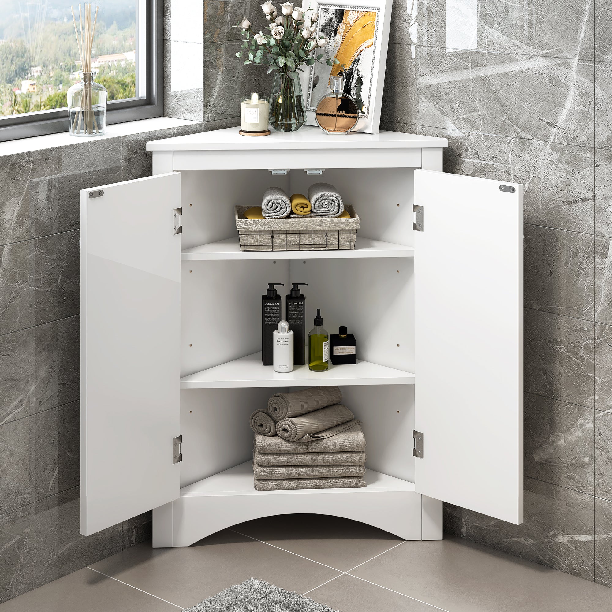 White triangle bathroom storage cabinet with a compact, space-saving design, featuring multiple shelves for organizing toiletries, towels, and other bathroom essentials. Made from durable materials, this sleek cabinet adds a functional and stylish touch to any bathroom decor.