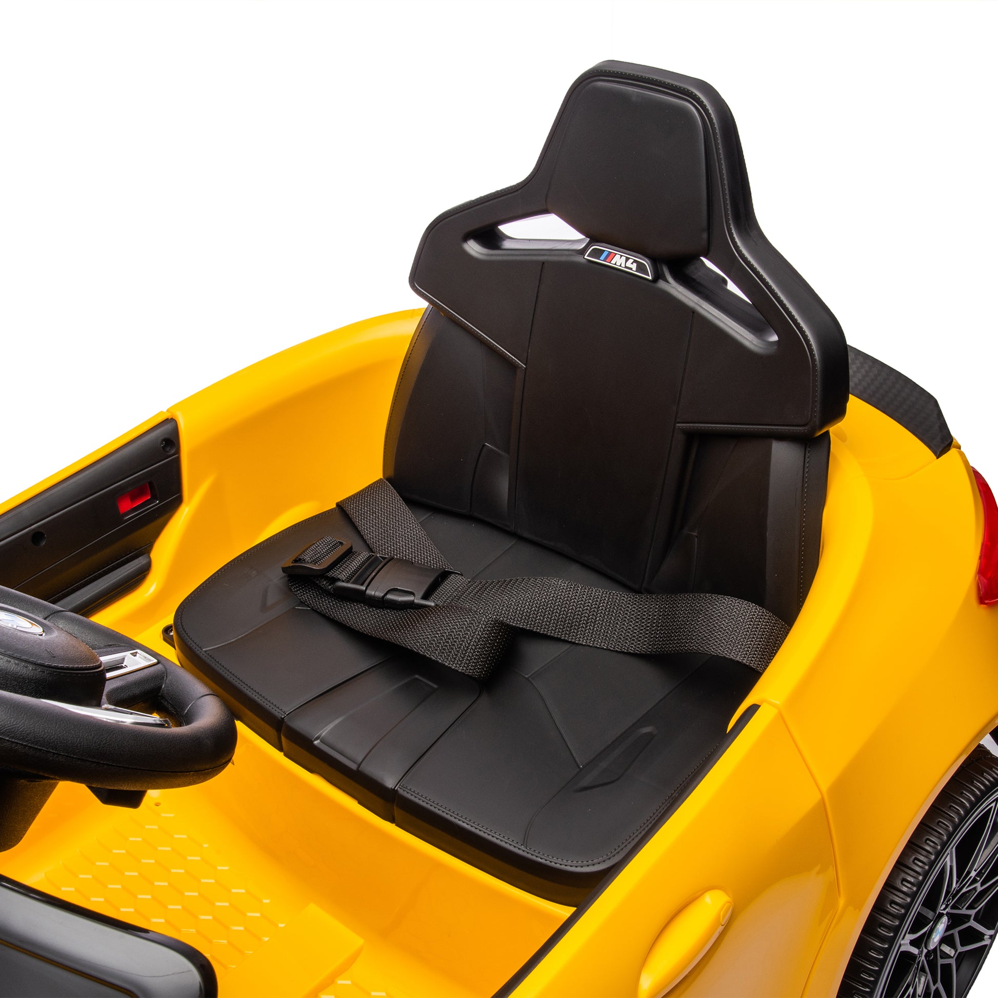 Yellow BMW M4 12V electric ride-on car for kids, featuring authentic design with working headlights, MP3 player, and forward/reverse motion. Comes with adjustable seat and steering wheel, providing a realistic driving experience for children aged 3-6