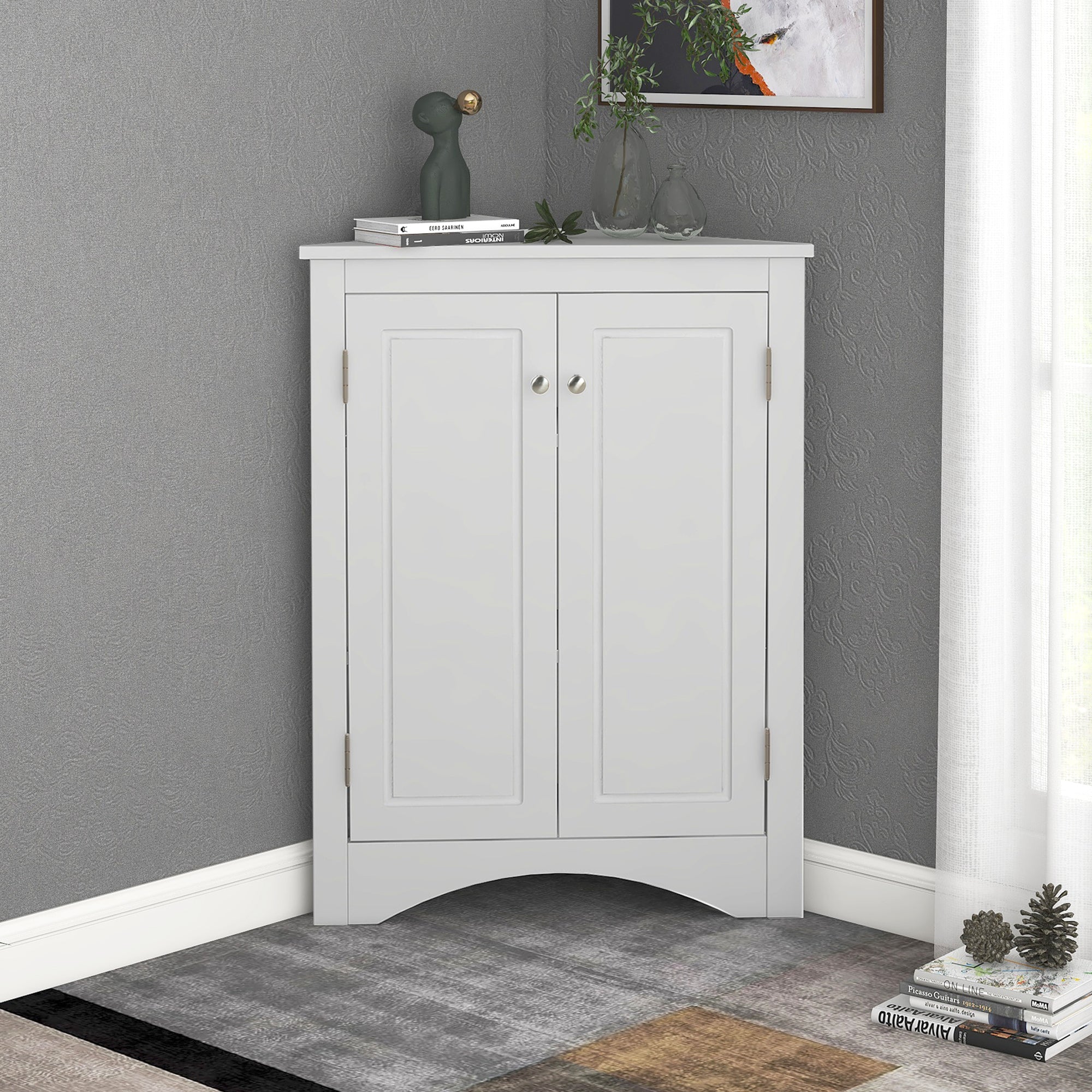 White triangle bathroom storage cabinet with a compact, space-saving design, featuring multiple shelves for organizing toiletries, towels, and other bathroom essentials. Made from durable materials, this sleek cabinet adds a functional and stylish touch to any bathroom decor.