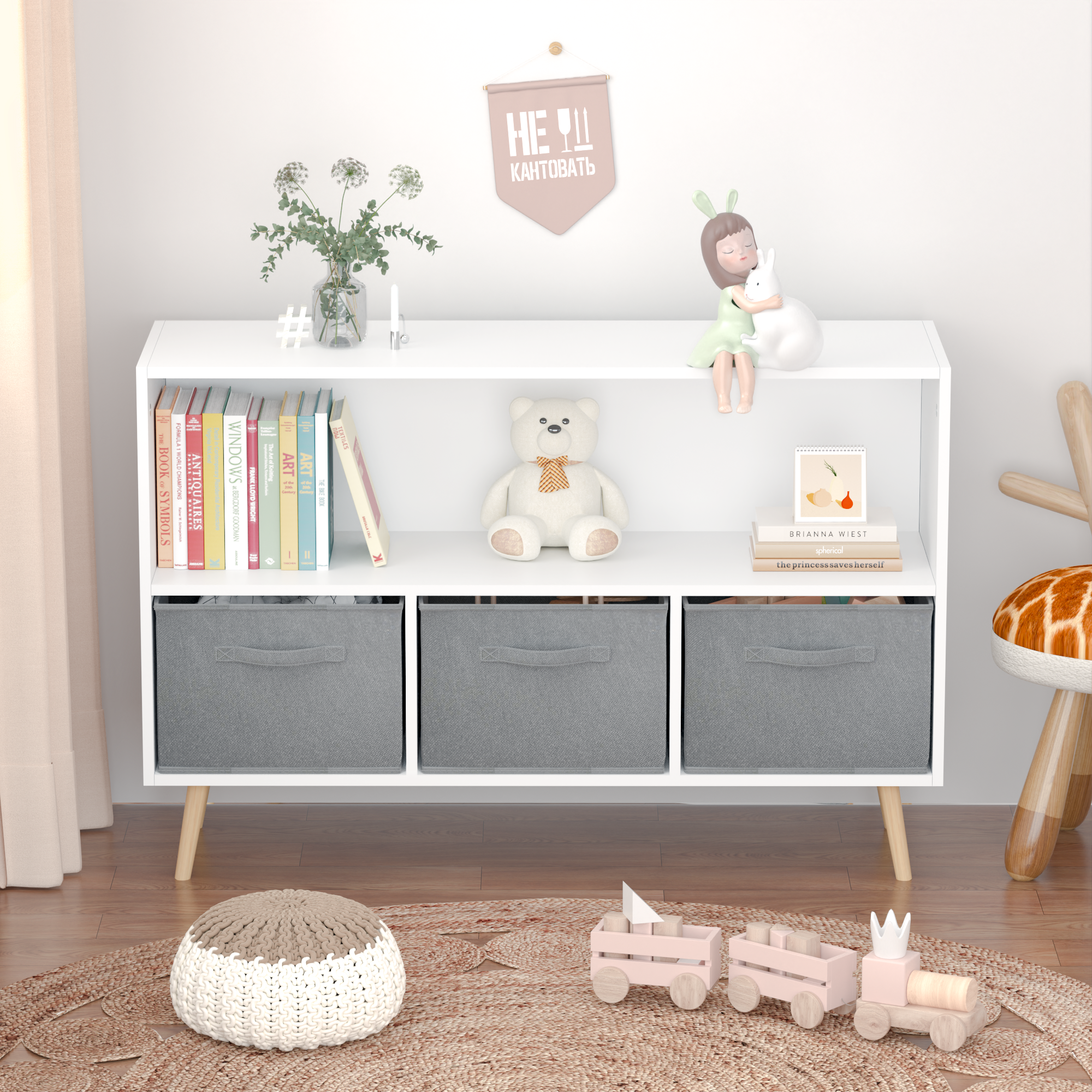 White kids bookcase with gray fabric drawers and books displayed