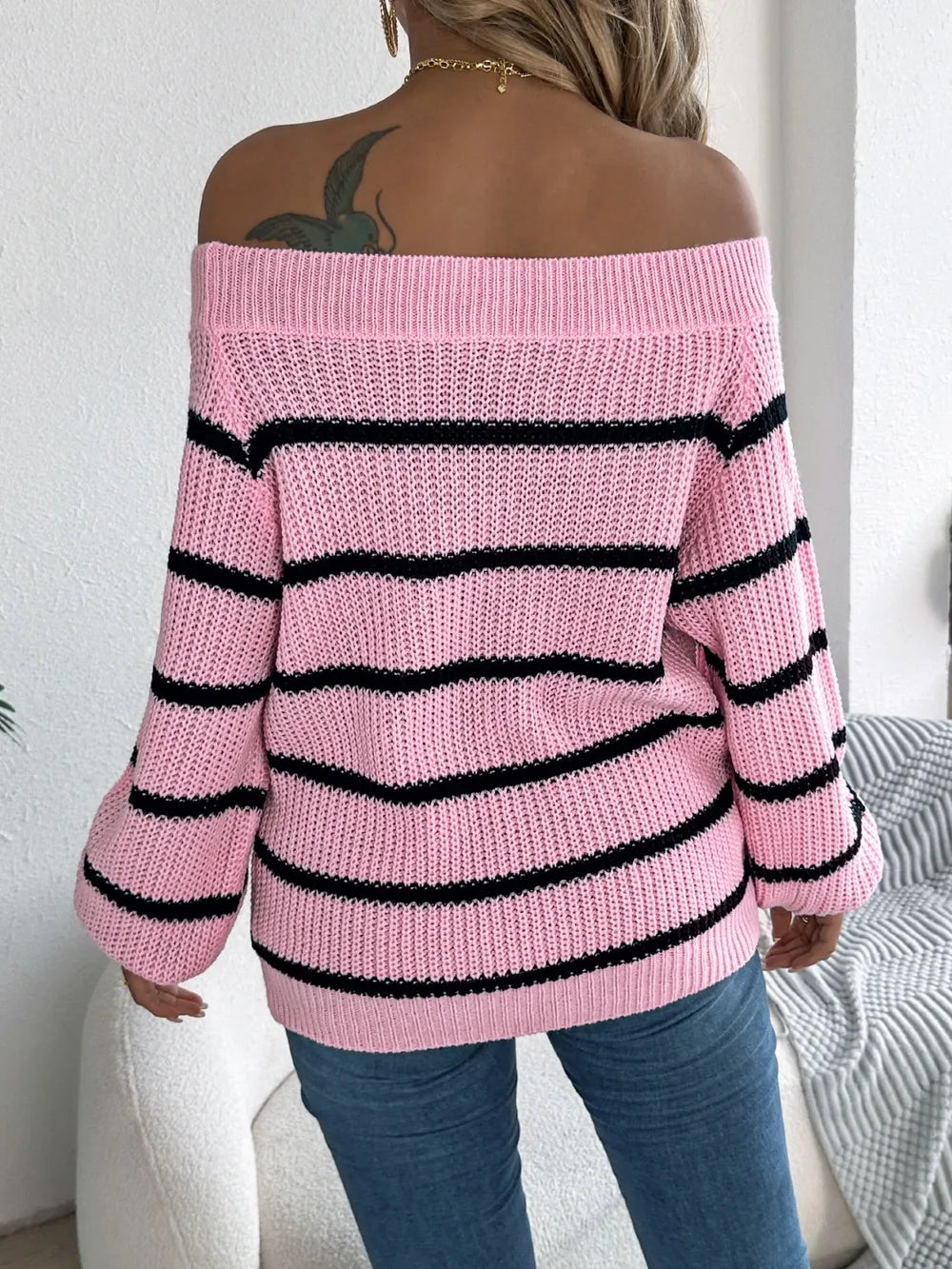 Women's striped off-shoulder sweater with long sleeves, front view

