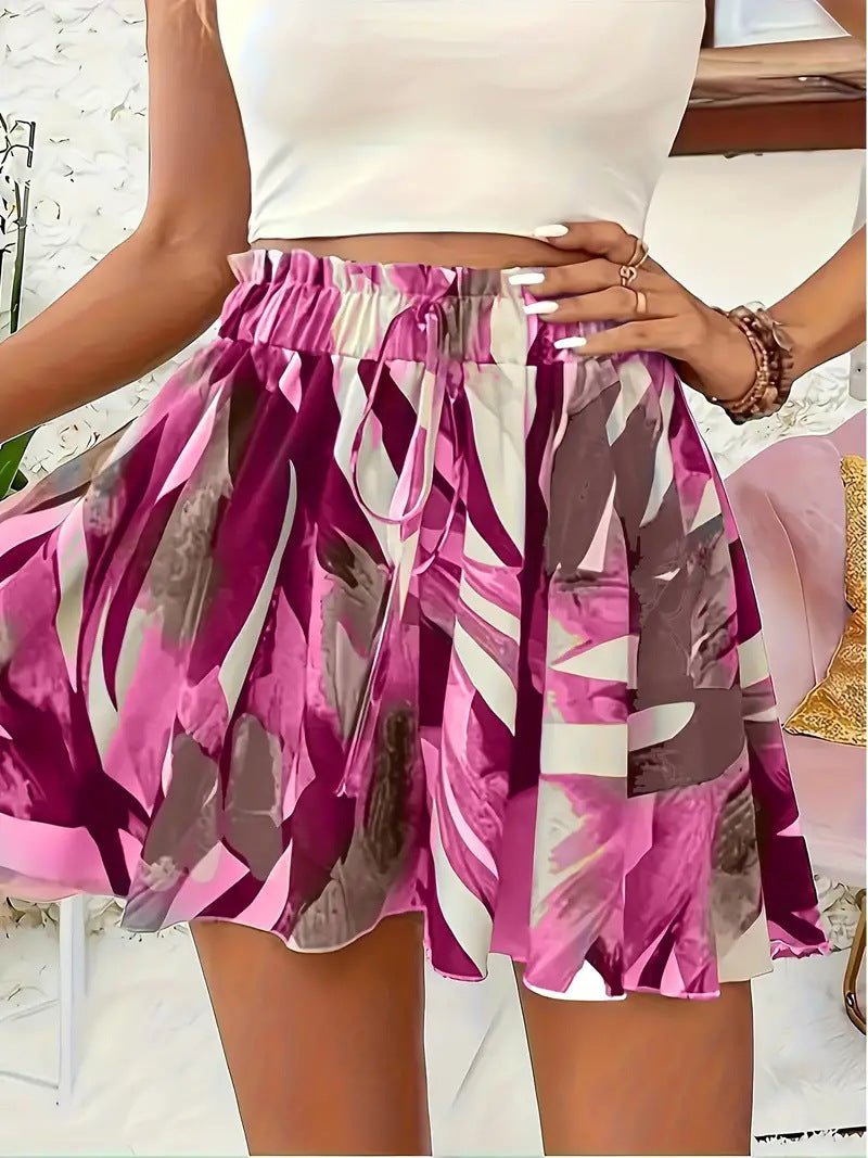 Women's summer shorts with elastic waistband and vibrant prints, ideal for casual wear and warm weather.








