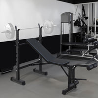 Olympic weight bench with adjustable squat rack, designed for strength training, featuring sturdy construction and multiple settings for bench press, squats, and other weightlifting exercises.