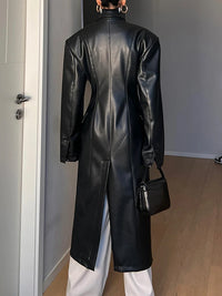 Model wearing a high-waist PU leather coat with patchwork detail and lapel collar
