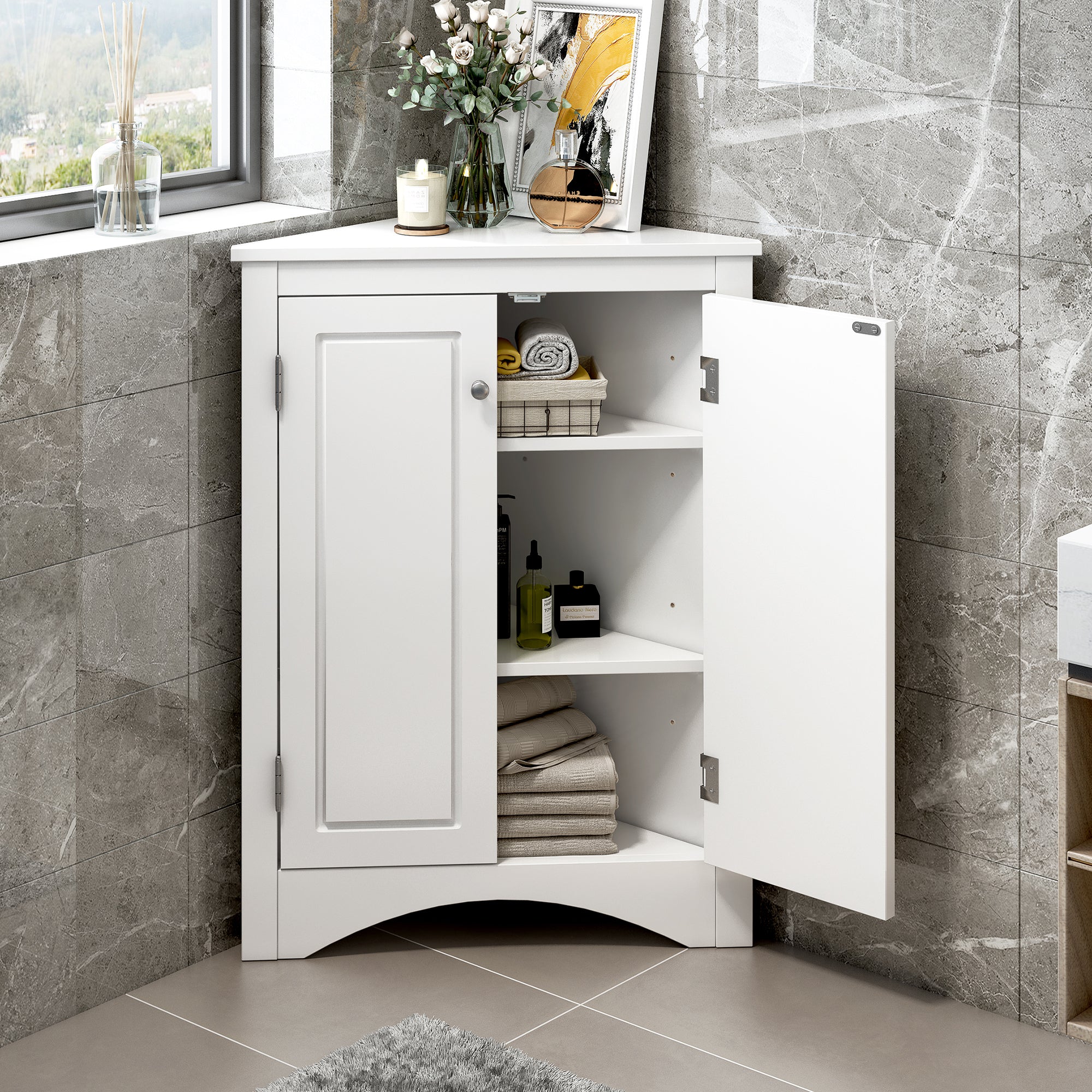 White triangle bathroom storage cabinet with a compact, space-saving design, featuring multiple shelves for organizing toiletries, towels, and other bathroom essentials. Made from durable materials, this sleek cabinet adds a functional and stylish touch to any bathroom decor.