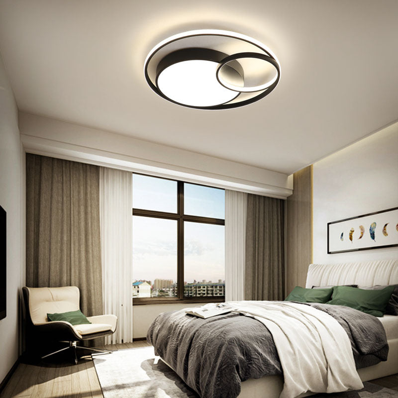 Modern Nordic-style nested round chandelier hanging in a minimalist living room

