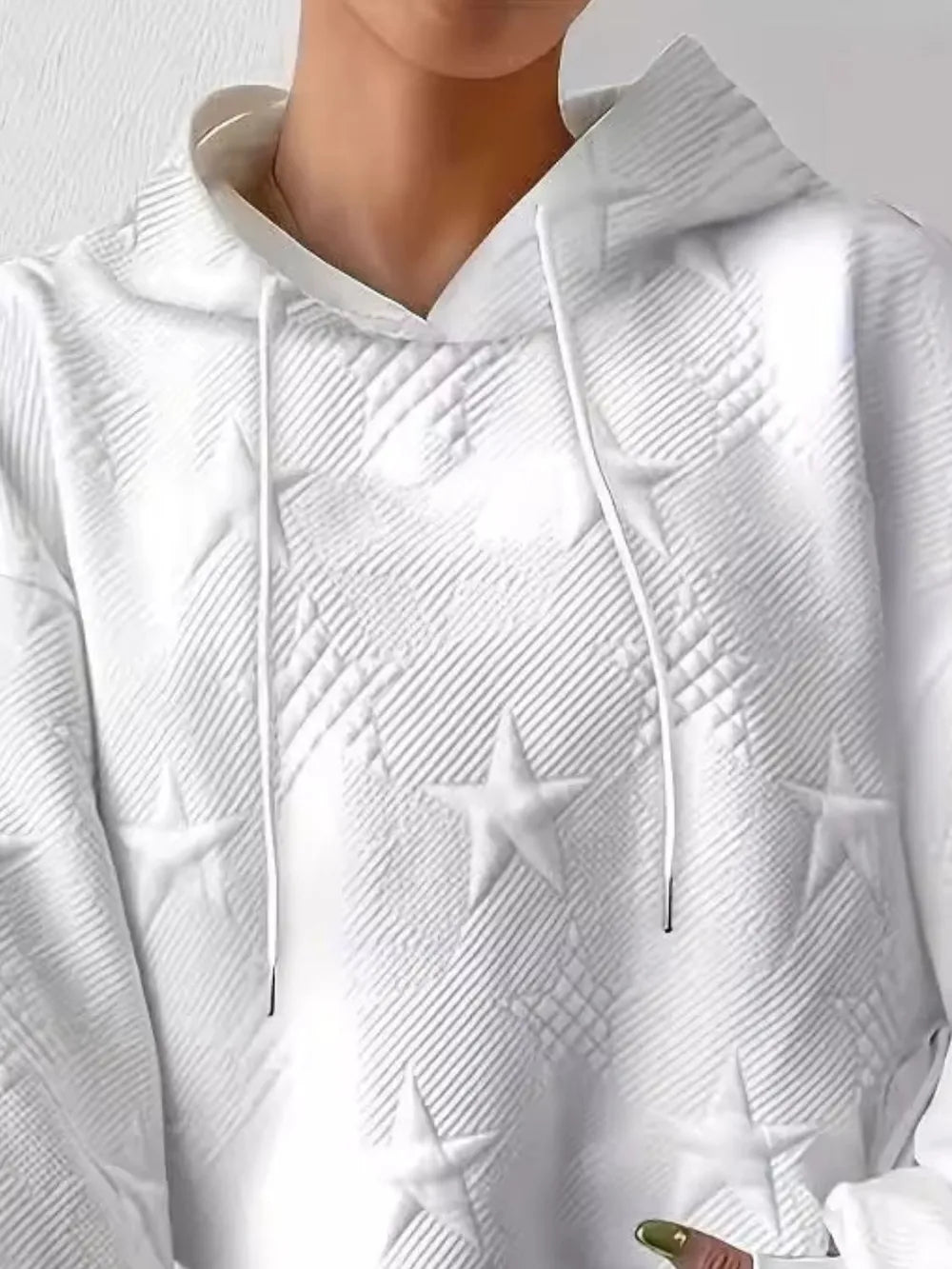 White women’s casual pullover hoodie with star texture and drawstring hood.








