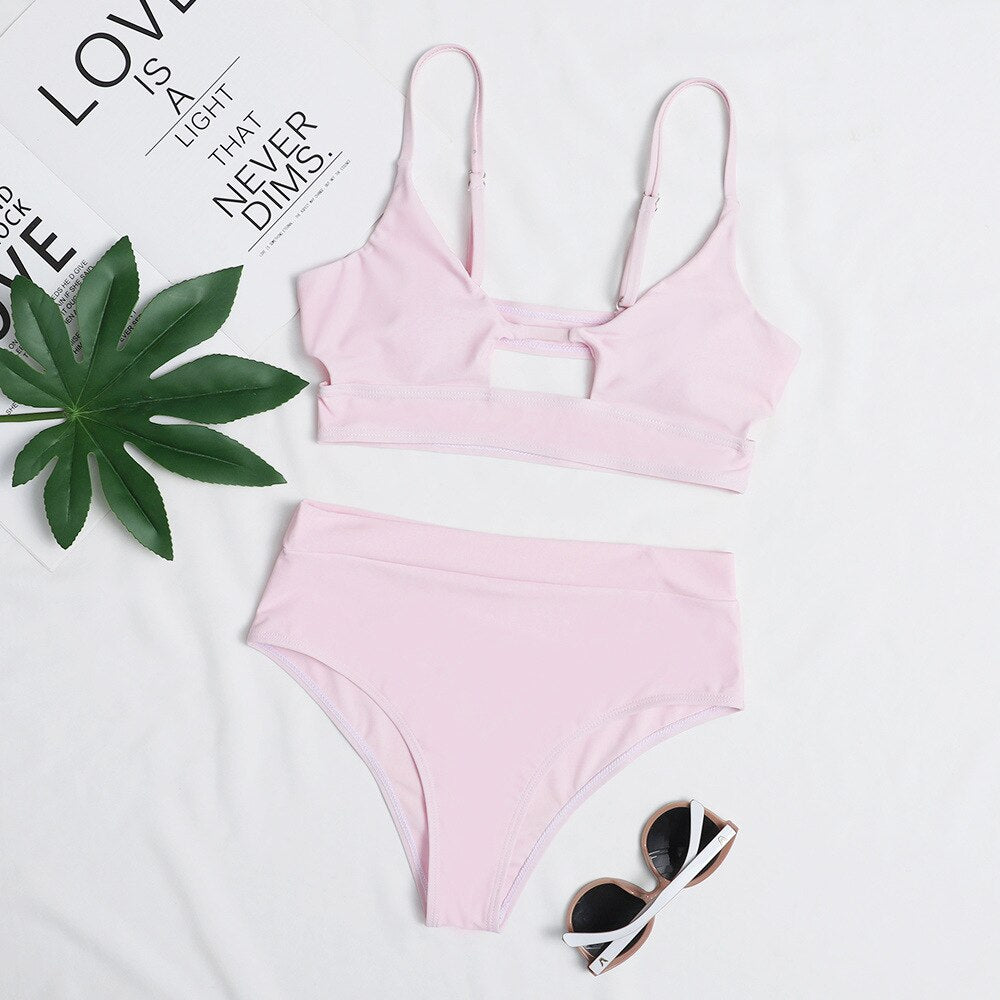 Surf Siren high-waist bikini featuring a retro-inspired design with a flattering high-waisted bottom for added comfort and support. Made from stretchy, durable fabric, perfect for beach days, poolside lounging, and stylish summer fun.
