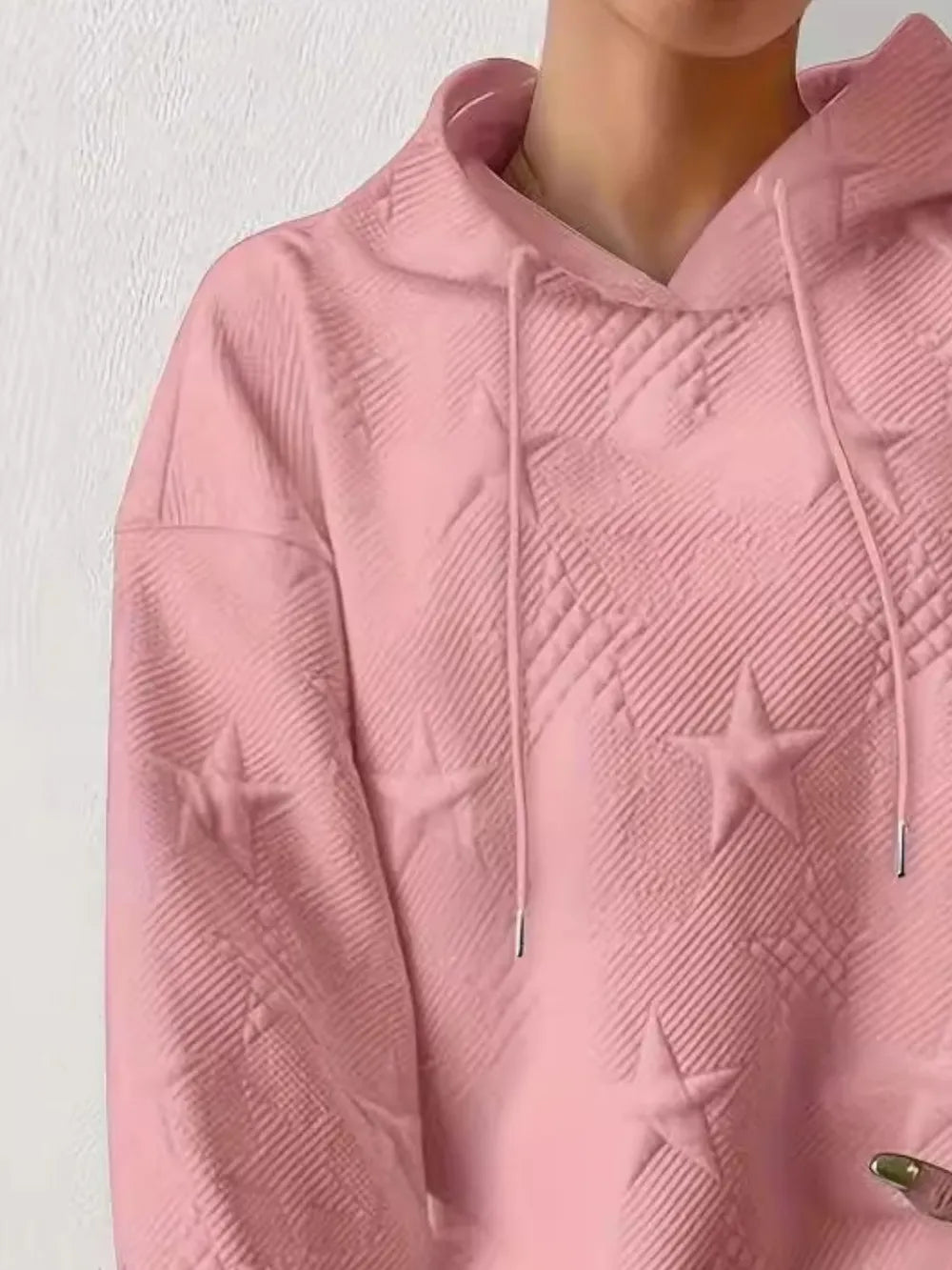 White women’s casual pullover hoodie with star texture and drawstring hood.









