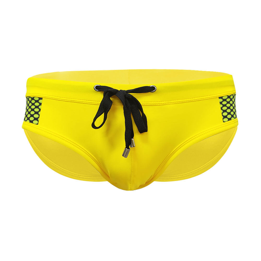 Men’s close-fitting swim briefs with polka dot stitching, designed for beach and sports activities.

