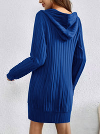 Blue ribbed hoodie worn by a person against a white background